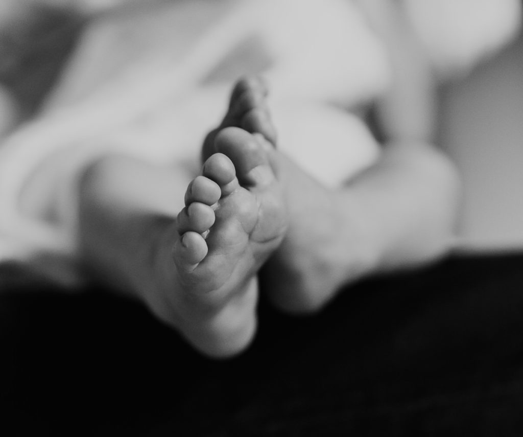 newborn feet, black and white image