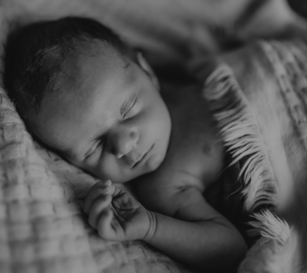 Black and white image of a newborn