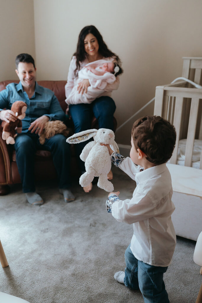 New York City in home newborn lifestyle photo session with toddler sibling.