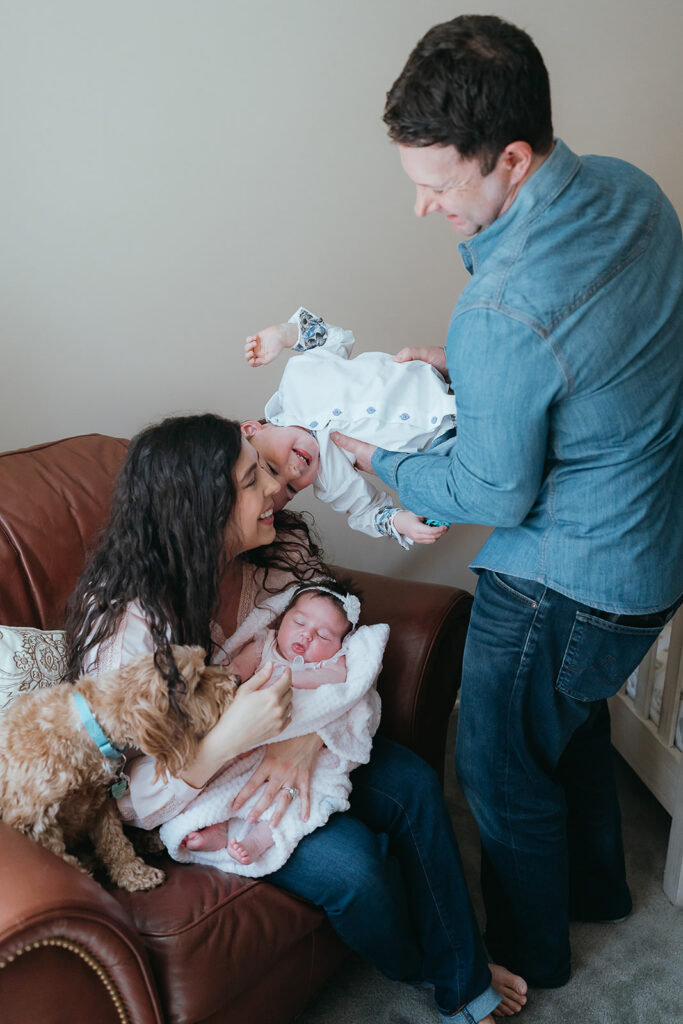 New York City in home newborn lifestyle photo session with toddler sibling and dog. 