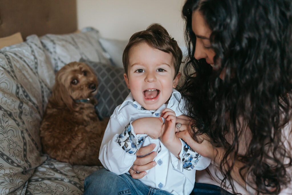 New York City in home newborn lifestyle photo session with toddler sibling and dog. 