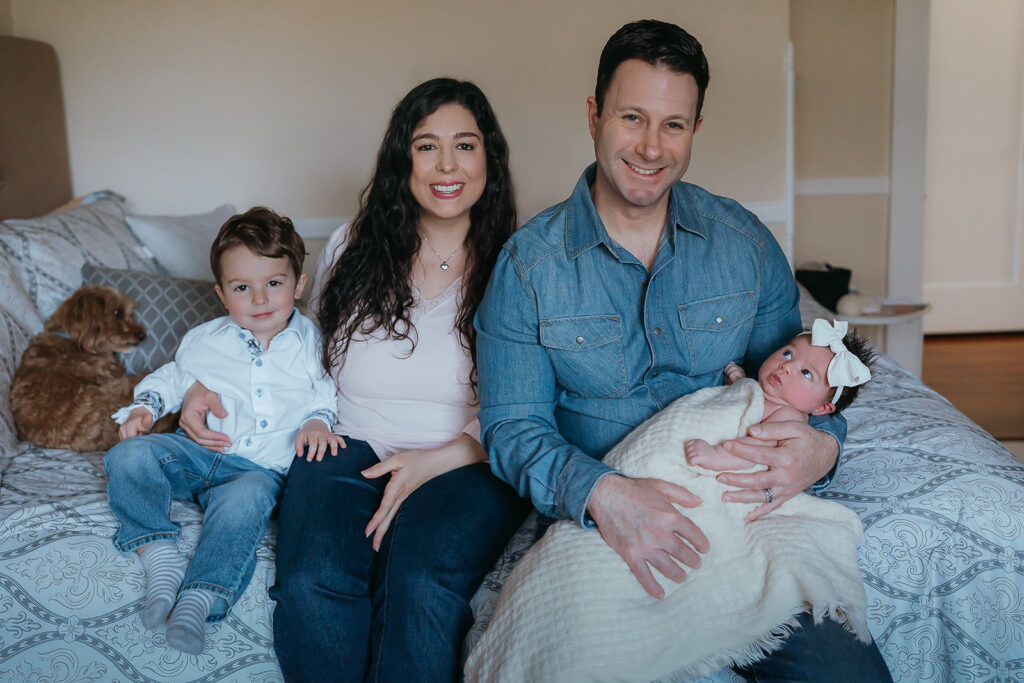 New York City in home newborn lifestyle photo session with toddler sibling and dog. 