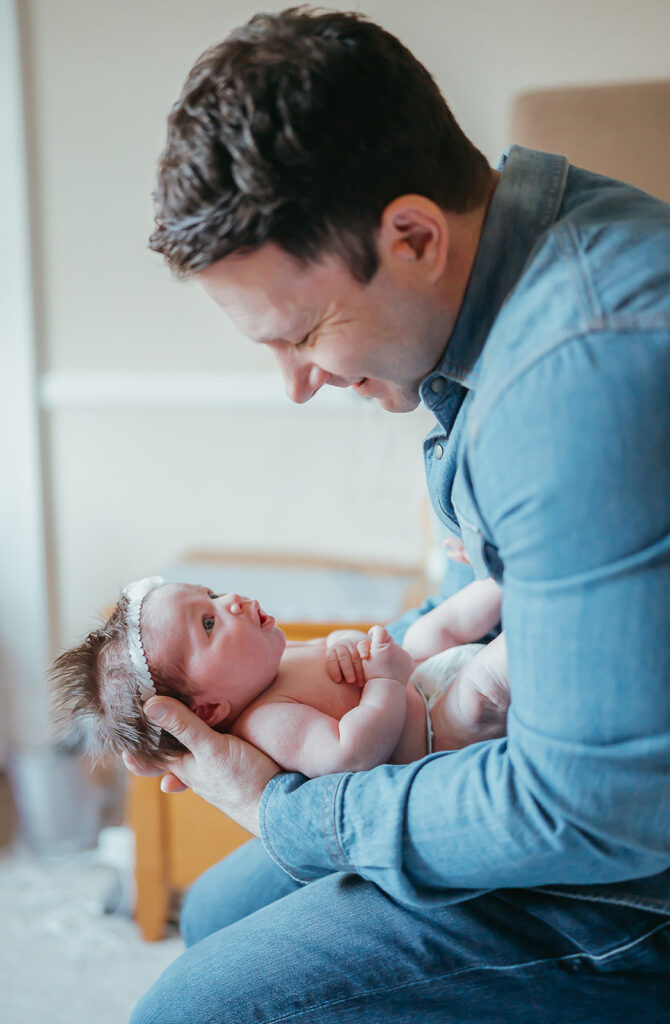 New York City in home newborn lifestyle photo session with toddler sibling and dog. 