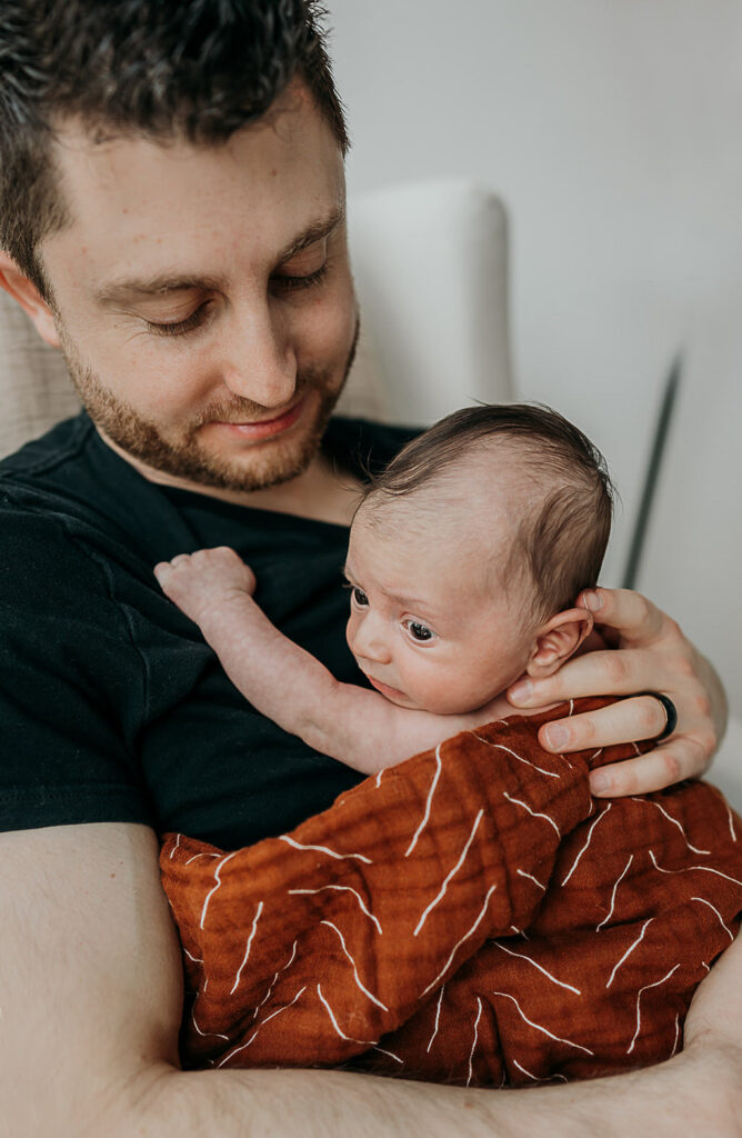 NYC in home family newborn session, family of three.