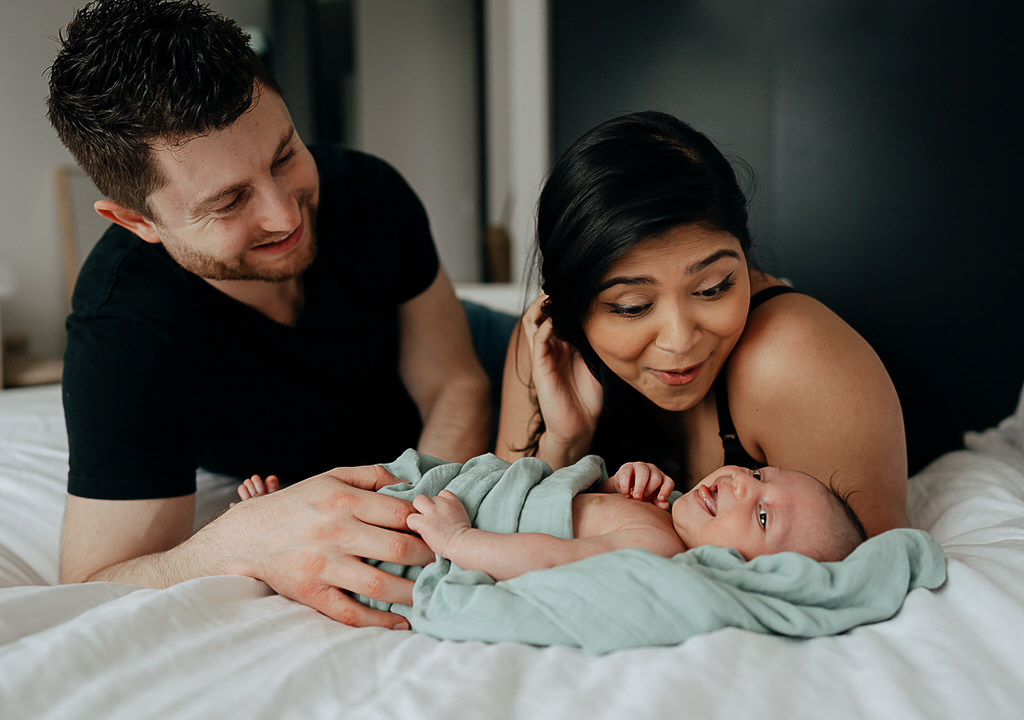 NYC in home family newborn session, family of three.