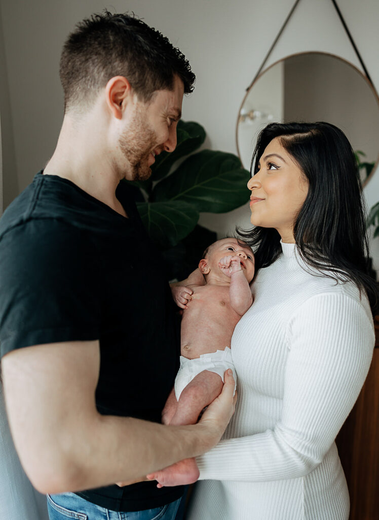 NYC in home family newborn session, family of three.