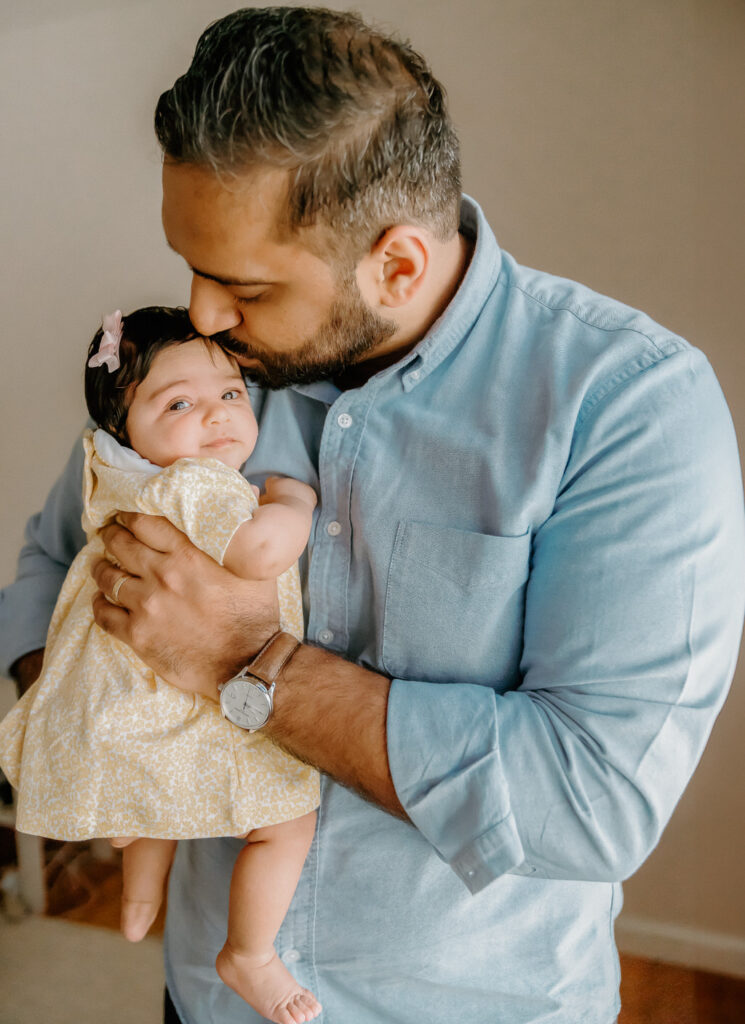 long island newborn session dad holding daughter